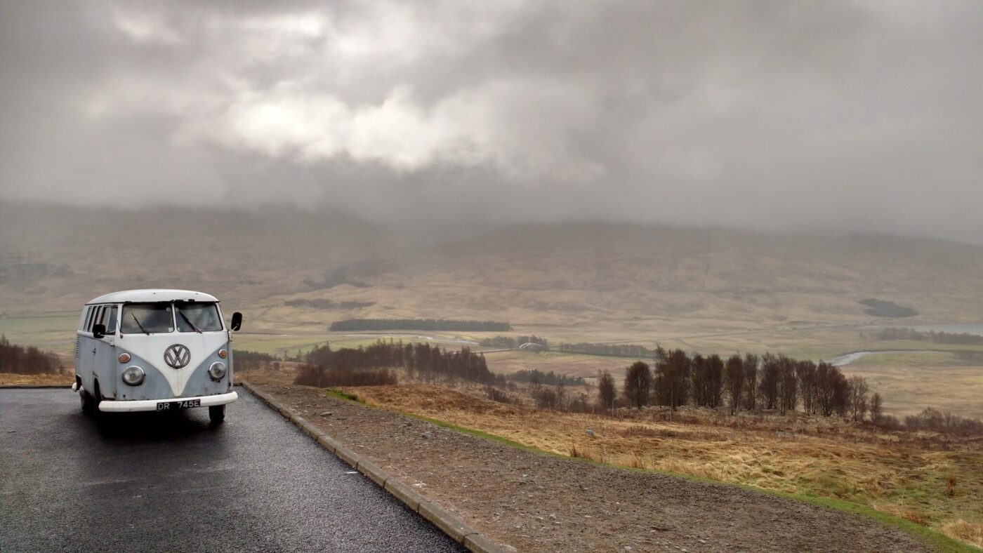 Off-grid campervan on a rural road exploring the United Kingdom